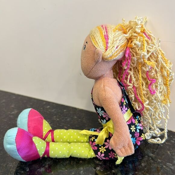 Denell -A blonde with a black floral dress.- Manhattan Toys. Size 13” - Picture 3 of 8